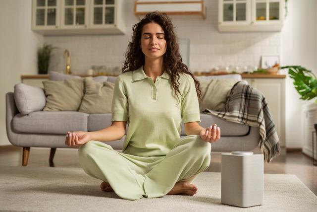 full-shot-woman-meditating-home_23-2149936251