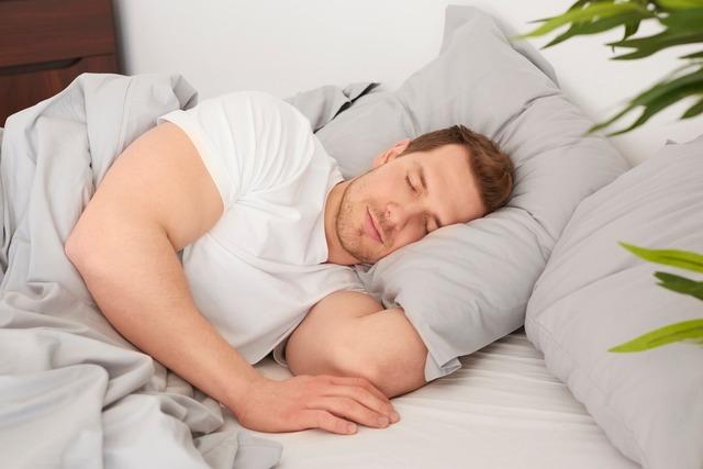 man-sleeping-comfortable-bed_329181-13878