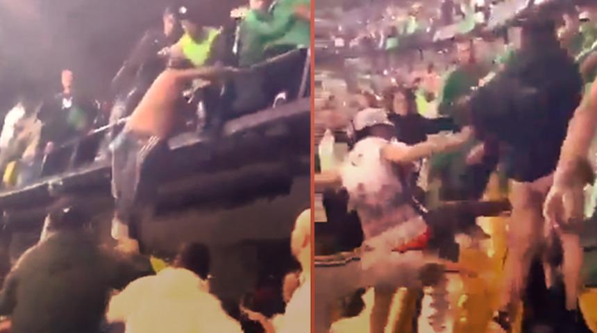 Kolombiya Ligi'nde maç devam ederken ortalık karıştı! Saldırmak için tribünden atladı... Taraftarlar birbirine girdi! 
