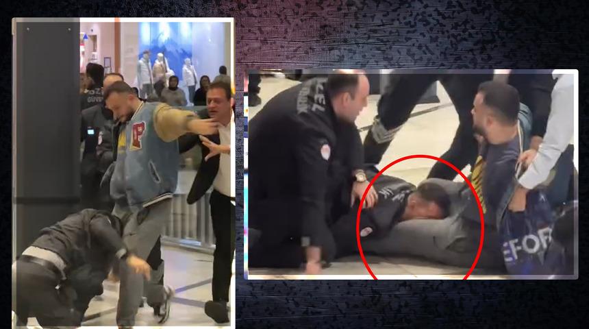 Alışveriş merkezinin ortasında birbirlerine girdiler... Kavga büyüdü güvenlik görevlisi hıncını alabilmek için vatandaşın bacağını ısırdı