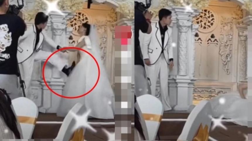 Düğün sırasında kötü haber alan damat öfkesine yenik düştü! Davetlilerin gözü önünde gelini tekmeleyerek sahnede düşürdü