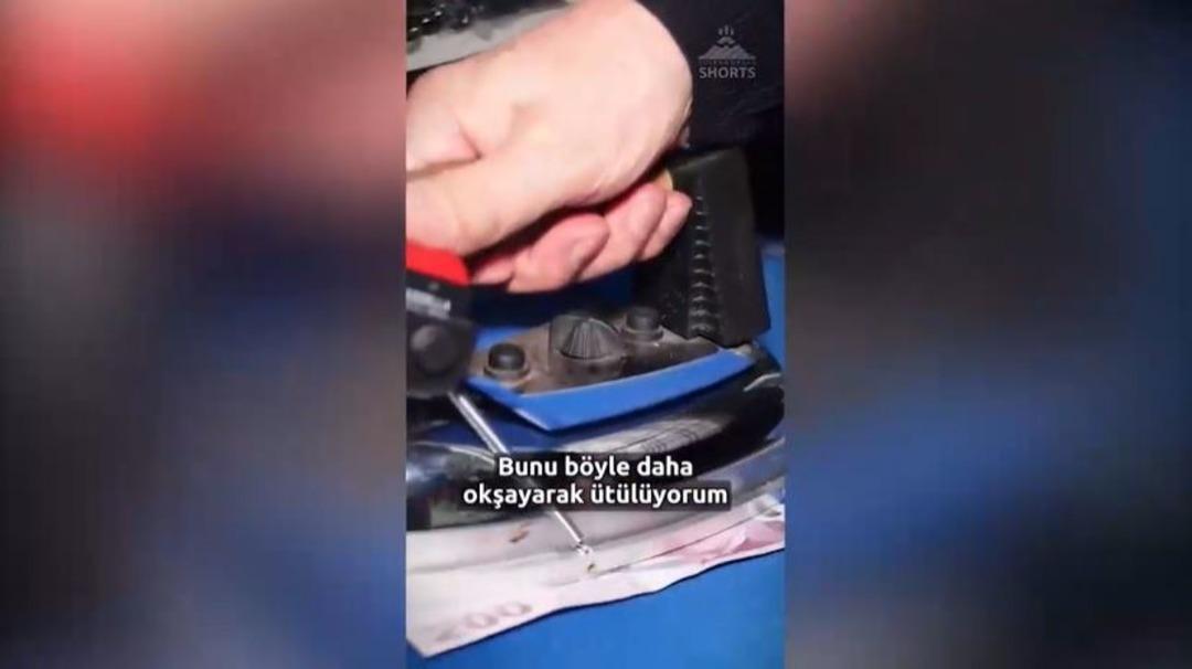 Kırışık paraya tahammülü yok! Bir esnaf, her banknotu tek tek ütüleyerek kullanıyor: "Sen parayı akordiyon gibi getiriyorsun, ben ütülemek zorunda kalıyorum" 1