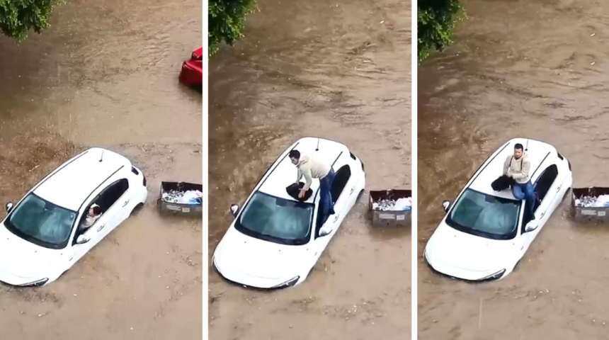 Sürüklenmeye başlayan otomobilin sürücüsü aracın üzerine çıkarak yardım bekledi