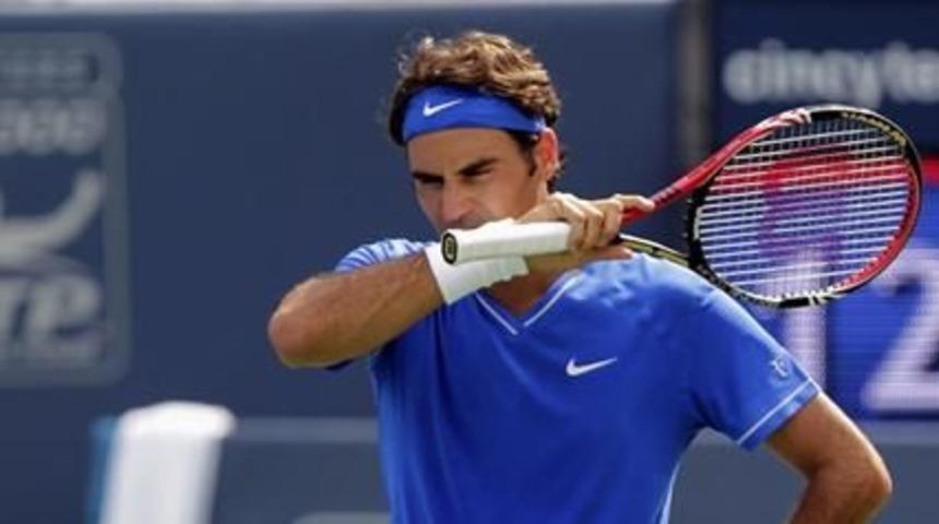 Federer bounced out, Djokovic survives