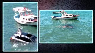 Direksiyon hakimiyetini kaybedip denize uçtu! Aracın üstünde kurtarılmayı bekledi