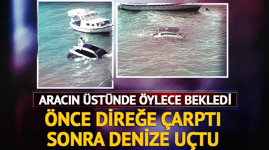 Direksiyon hakimiyetini kaybedip denize uçtu! Aracın üstünde kurtarılmayı bekledi
