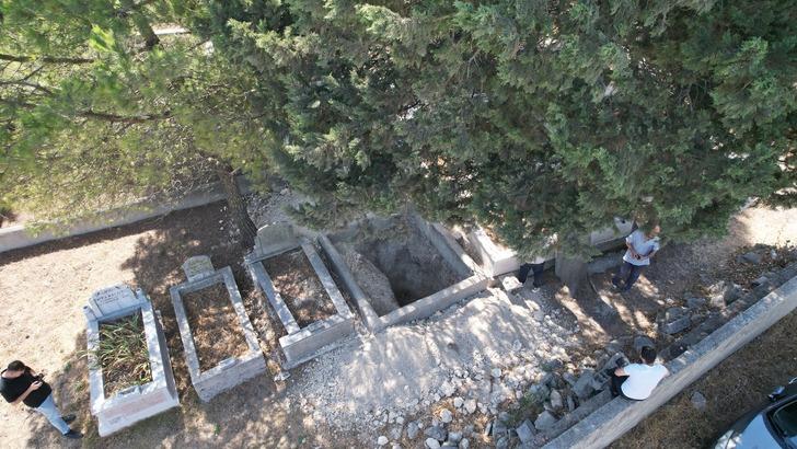 Mezarları metrelerce kazıp defin arıyorlar! Savunmaları pes dedirtti: "Kemiklerini çalmadık, duruyor" G1