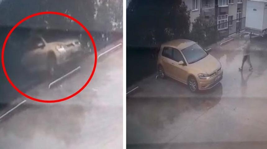 Otomobilini yanlışlıkla geri vitese alınca, 7 metre yükseklikten düştü; kaza anı kamerada