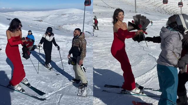 Kırmızı elbisesiyle kayak pistinde şov yaptı! Gül dağıttığı anlar ilgi çekti