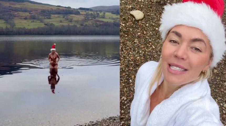 &Uuml;nl&uuml; sunucu kırmızı bikinisiyle buz gibi g&ouml;lde y&uuml;zd&uuml;!