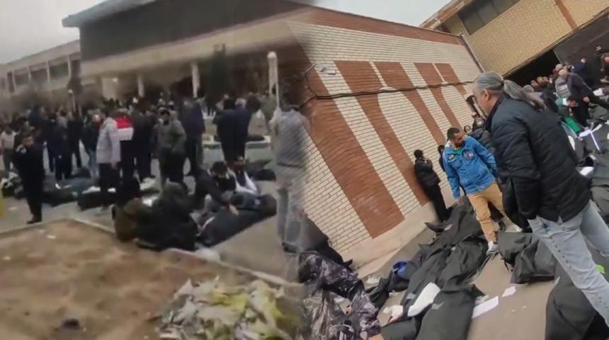 D&uuml;nyanın g&ouml;z&uuml; İran'da! Korkun&ccedil; g&ouml;r&uuml;nt&uuml;ler: Ceset torbaları hastane bah&ccedil;esine yığıldı