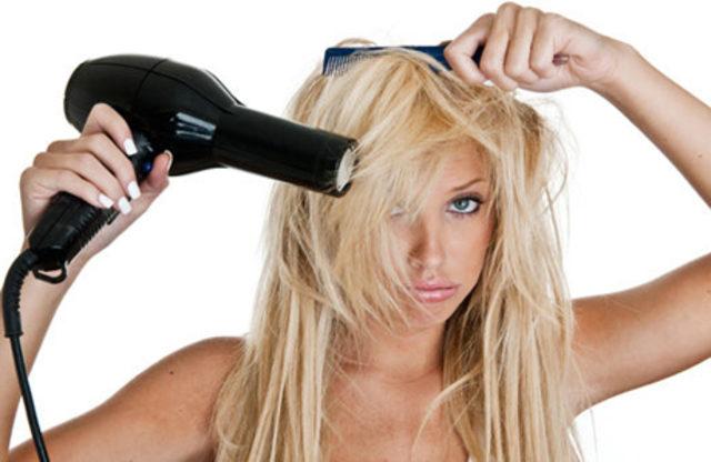 WomanBlowDryingHair article