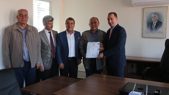 Mut OSB’de 112 parselin tapusu Mut Ticaret Odası’na teslim edildi