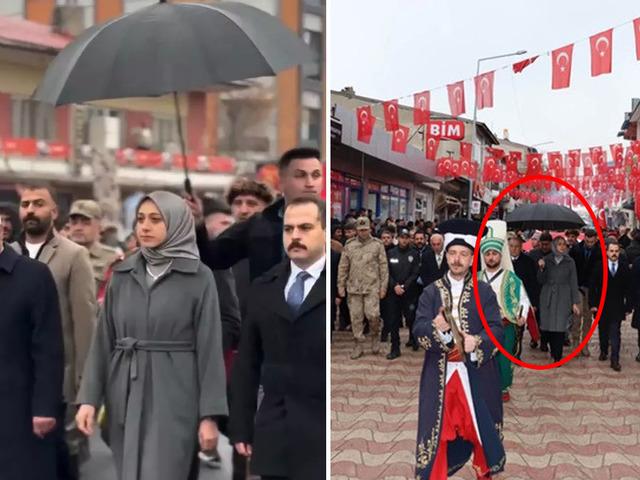 Koruma polisinin şemsiye tuttuğu g&ouml;r&uuml;nt&uuml; tepki &ccedil;ekmişti! 