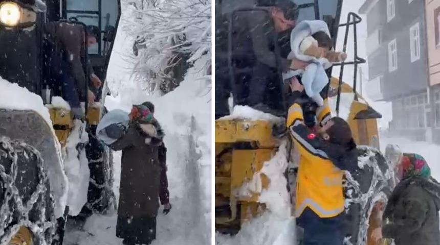 Ordu'da hastalanan bebek, kardan kapanan yolda iş makinesi ile taşındı
