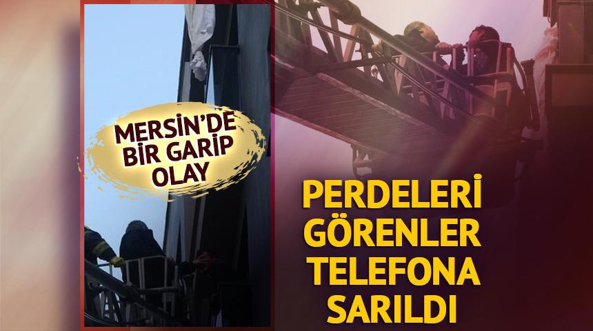 Perde ile altıncı kattan sarkan şahıs &uuml;&ccedil;&uuml;nc&uuml; kat balkonuna d&uuml;şt&uuml;
