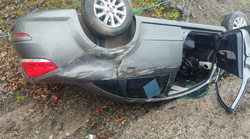 Takla atan otomobilden yara almadan kurtuldu