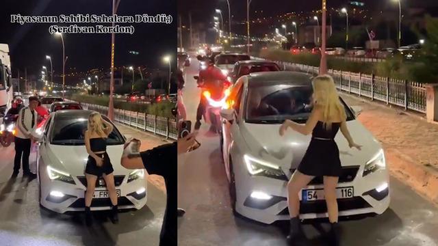 Bu ne kendini bilmezlik! Trafiği durdurup aracın önünde dans etti