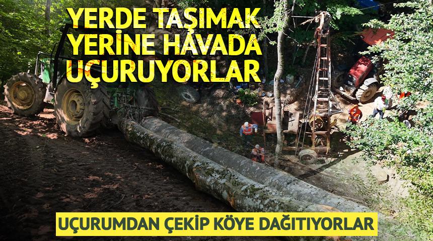 Yerde taşımak yerine havada u&ccedil;uruyorlar: K&ouml;ye dağıtıyorlar
