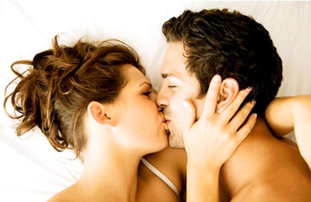 kissing couple in bed