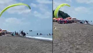 Motorlu yama&ccedil; paraş&uuml;t&uuml;yle tatilcilerin arasına daldı