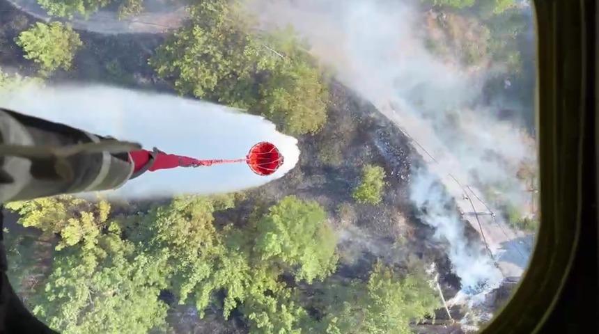 Ula&rsquo;da yol kenarında &ccedil;ıkan yangın b&uuml;y&uuml;meden s&ouml;nd&uuml;r&uuml;ld&uuml;