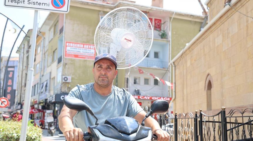 Sıcaktan bunalan vatandaştan ilgin&ccedil; &ccedil;&ouml;z&uuml;m