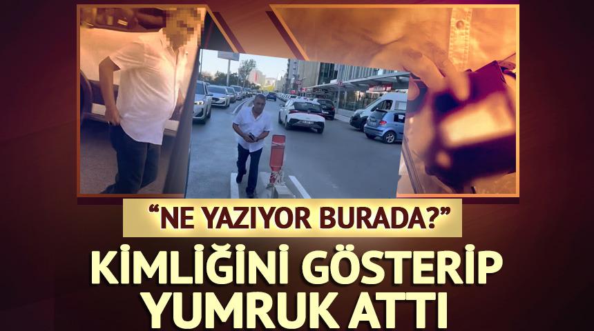 Kimliğini g&ouml;sterip s&uuml;r&uuml;c&uuml;y&uuml; yumrukladı: "Ne yazıyor burada?"