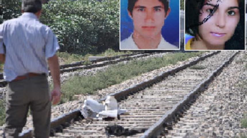 Eşini bı&ccedil;aklayıp, trenin &ouml;n&uuml;ne atladı