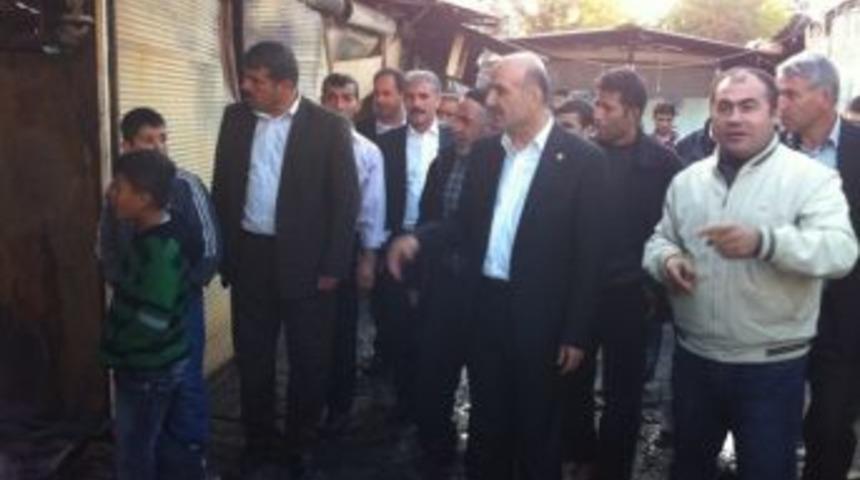 &Ouml;zdemir yangının k&uuml;l ettiği semt pazarında incelemelerde bulundu