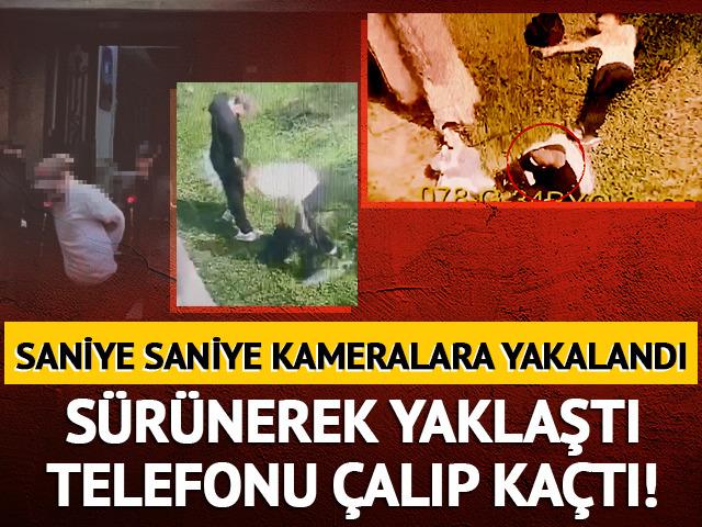 S&uuml;r&uuml;nerek yaklaştı: Telefonu &ccedil;alıp ka&ccedil;tı! Kameralara yakalandı