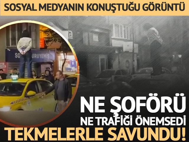 Yer: Şişli... Taksinin &uuml;zerine &ccedil;ıkıp dakikalarca durdu: Kendisini tekmelerle savundu!