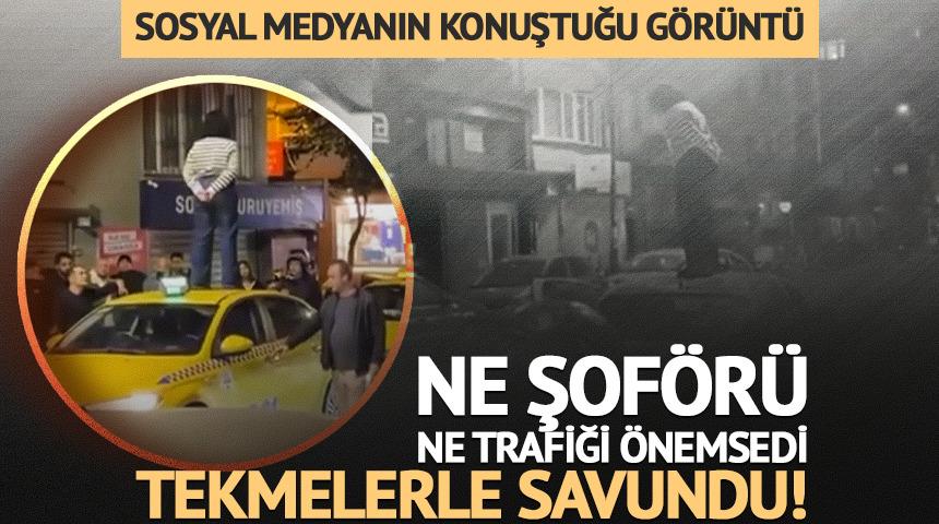 Yer: Şişli... Taksinin &uuml;zerine &ccedil;ıkıp dakikalarca durdu: Kendisini tekmelerle savundu!