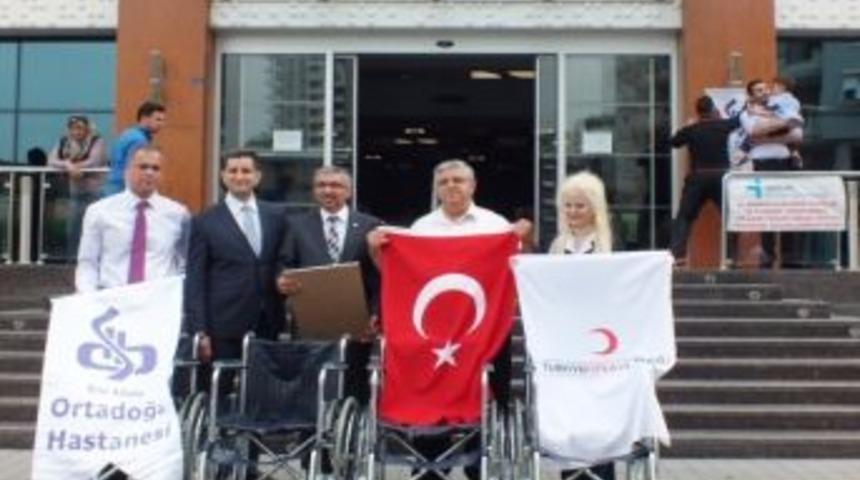 Suriyelilere tekerlekli sandalye bağışı