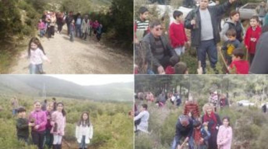 Milaslı minik &Ouml;ğrenciler, &ccedil;am fidanlarını toprakla buluşturdular