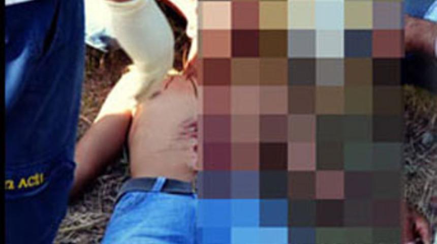 Mezarlıkta kendini doğradı