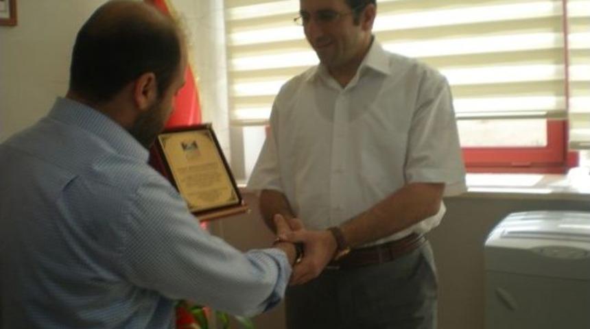 Stk'lardan Dkhb Genel Sekreteri Kurtoğlu'na Plaket