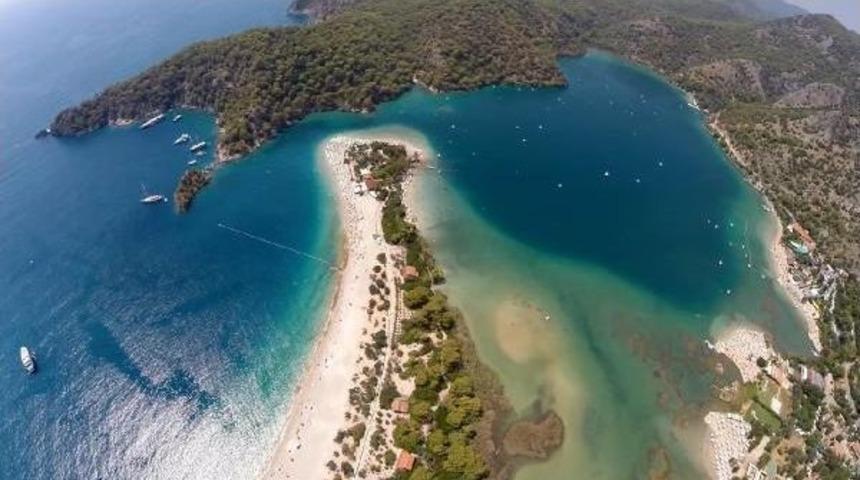 Paragliders Flock To Babadağ, While Beach Lovers Enjoy &Ouml;l&uuml;deniz