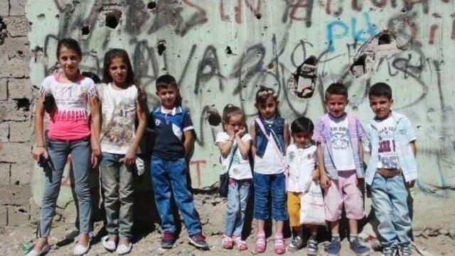 Children Of Curfew-Struck Cizre And Hollow Wooden Swings