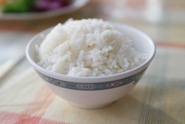 Steamed Rice Served In Bowl On Table