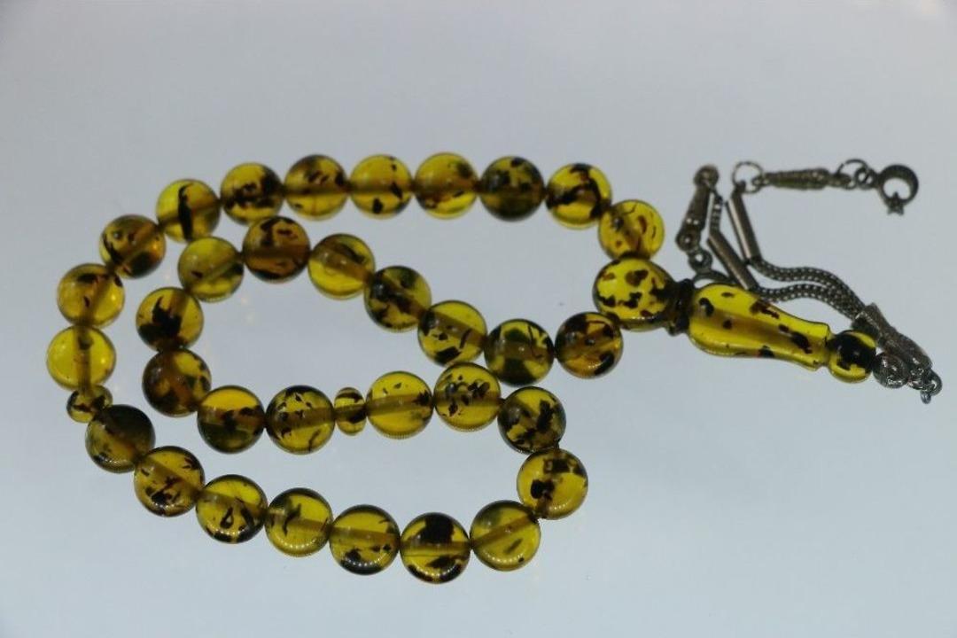 Bu Tespihlerin İ&ccedil;inde 100 Bin Yıllık Fosiller Var