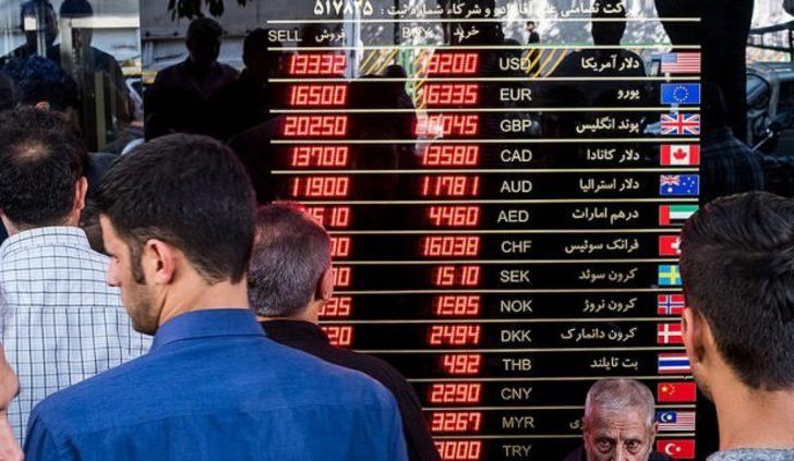   İran'da halk dolar bozdurmak için sarraflara hücum etti
